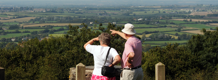 Two people looking at the fields and view of the bridge in South Gloucestershire