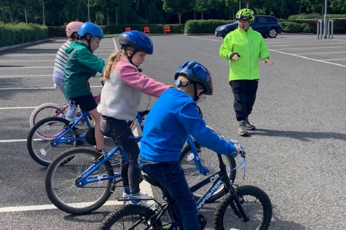 Children on bikes at a training session